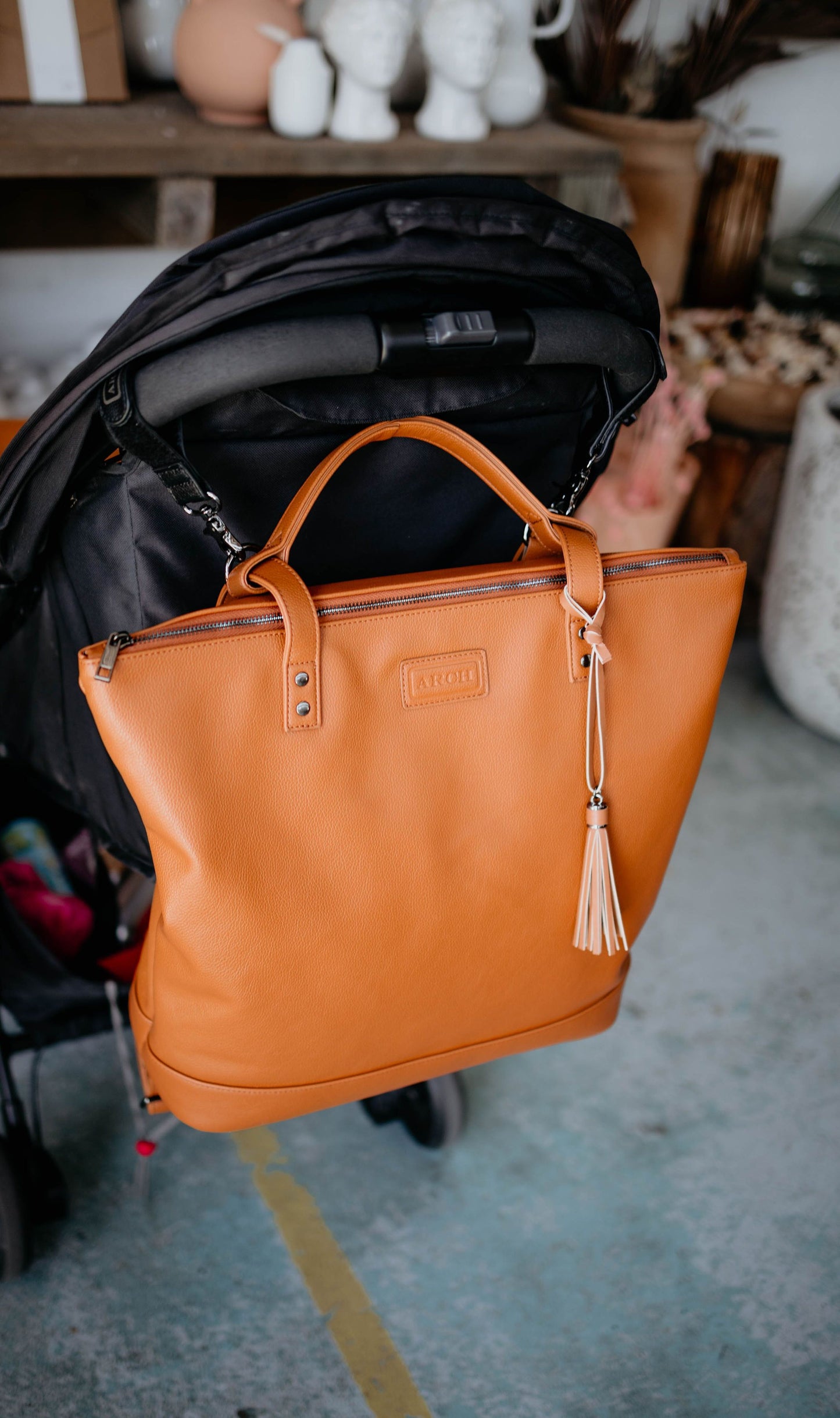 Black pram clips and vegan leather nappy bag
